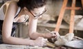 Young artist moulding raw clay in art studio Royalty Free Stock Photo