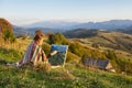 Young artist painting an autumn landscape Royalty Free Stock Photo