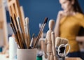 Young artist watching her painting on the easel Royalty Free Stock Photo