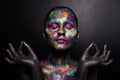 Young artistic woman in black paint and colourful powder. Glowing dark makeup. Creative body art on the theme of space Royalty Free Stock Photo