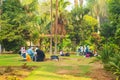 Young artists paint en plein air in a city park