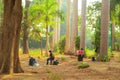 Young artists paint en plein air in a city park