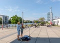 Young artists performing in a square by the Berlin Wall at the East Side Gallery