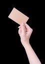 Young asia clean girl hand holding a blank kraft brown paper card template isolated on black background, clipping path, close up, Royalty Free Stock Photo