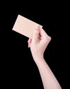 Young asia clean girl hand holding a blank kraft brown paper card template isolated on black background, clipping path, close up, Royalty Free Stock Photo