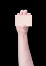 Young asia clean girl hand holding a blank kraft brown paper card template isolated on black background, clipping path, close up, Royalty Free Stock Photo