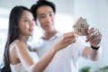 Young Asia couple planning to buy a house