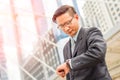 Young Asia handsome businessman looking at his watch Royalty Free Stock Photo