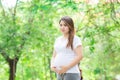 Young Asia pregnant in beautifull garden