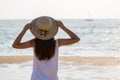 Young asia woman with hat on beach Royalty Free Stock Photo