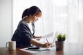 Young Asia woman working with laptop in living room