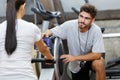 Young asian adult woman exercising using rowing machine Royalty Free Stock Photo