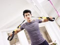 Young asian adult working out in gym Royalty Free Stock Photo