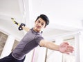 Young asian adult working out in gym Royalty Free Stock Photo
