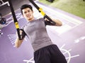 Young asian adult working out in gym Royalty Free Stock Photo