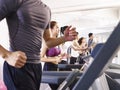 Asian young people working out on treadmill Royalty Free Stock Photo