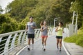 young asian adults running jogging outdoors Royalty Free Stock Photo