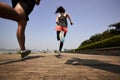 Young asian adults running outdoors Royalty Free Stock Photo