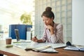 Young female architect working on blueprints in an office Royalty Free Stock Photo