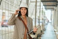 Young asian architect woman smiling happy talking on the smartphone at the city Royalty Free Stock Photo