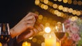 Young asian ask girlfriends to marry in romantic dinner drinking wine in rooftop restaurant at city night with happy moment Royalty Free Stock Photo