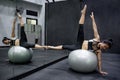 Asian athlete woman doing exercise with ball Royalty Free Stock Photo