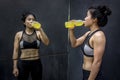 Young Asian athlete woman drinking sport drink Royalty Free Stock Photo