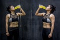 Young Asian athlete woman drinking sport drink Royalty Free Stock Photo