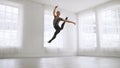 Young Asian ballet dancer practicing in a room alone