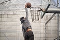 Young asian basketball player attempting a dunk Royalty Free Stock Photo