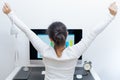 Young Asian beautiful woman sitting in front of computer and stretch oneself after long working. stress-free and relax