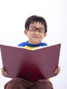 Young asian boy with book Royalty Free Stock Photo