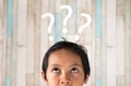 Young asian boy looking to question mark Royalty Free Stock Photo