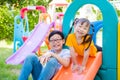 Boy playing with his sister at playground Royalty Free Stock Photo