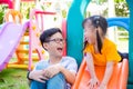 Boy playing with his sister at playground Royalty Free Stock Photo