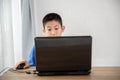 Young Asian boy using laptop technology at home. copyspace Royalty Free Stock Photo