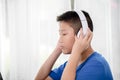 Young Asian boy using laptop technology at home. copyspace Royalty Free Stock Photo