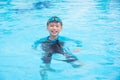 Boy wearing blue goggles and smiling in pool Royalty Free Stock Photo