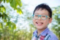 Young asian boy smiling in park Royalty Free Stock Photo