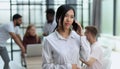 young asian business lady in white shirt talking on the phone Royalty Free Stock Photo