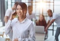 young asian business lady in white shirt talking on the phone Royalty Free Stock Photo