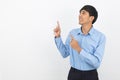 Young asian business man with blue shirt pointing to the side with a hand to present a product Royalty Free Stock Photo