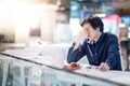 Young Asian business man feeling stressed while working with lap Royalty Free Stock Photo