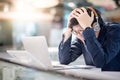 Young Asian business man feeling stressed while working with lap Royalty Free Stock Photo