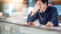 Young Asian business man feeling stressed while working with lap Royalty Free Stock Photo