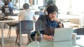 Asian man working with laptop in workplace