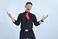 Young asian business man happy and excited celebrating, expressing big success, yelling celebrating, winning gesture Royalty Free Stock Photo