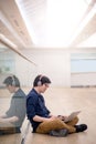 Young Asian business man listening to music while using laptop Royalty Free Stock Photo