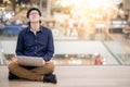 Young Asian business man listening to music while using laptop Royalty Free Stock Photo