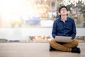 Young Asian business man listening to music while using laptop Royalty Free Stock Photo